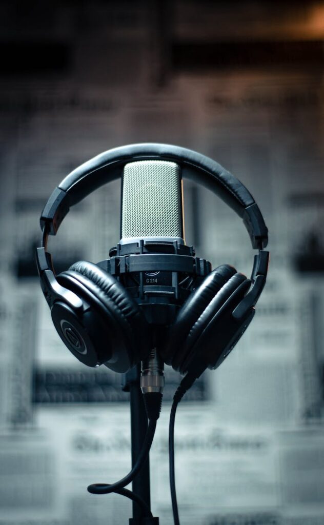 Studio Brčko Microphone with headphones in a studio environment, perfect for sound recording and podcasting.